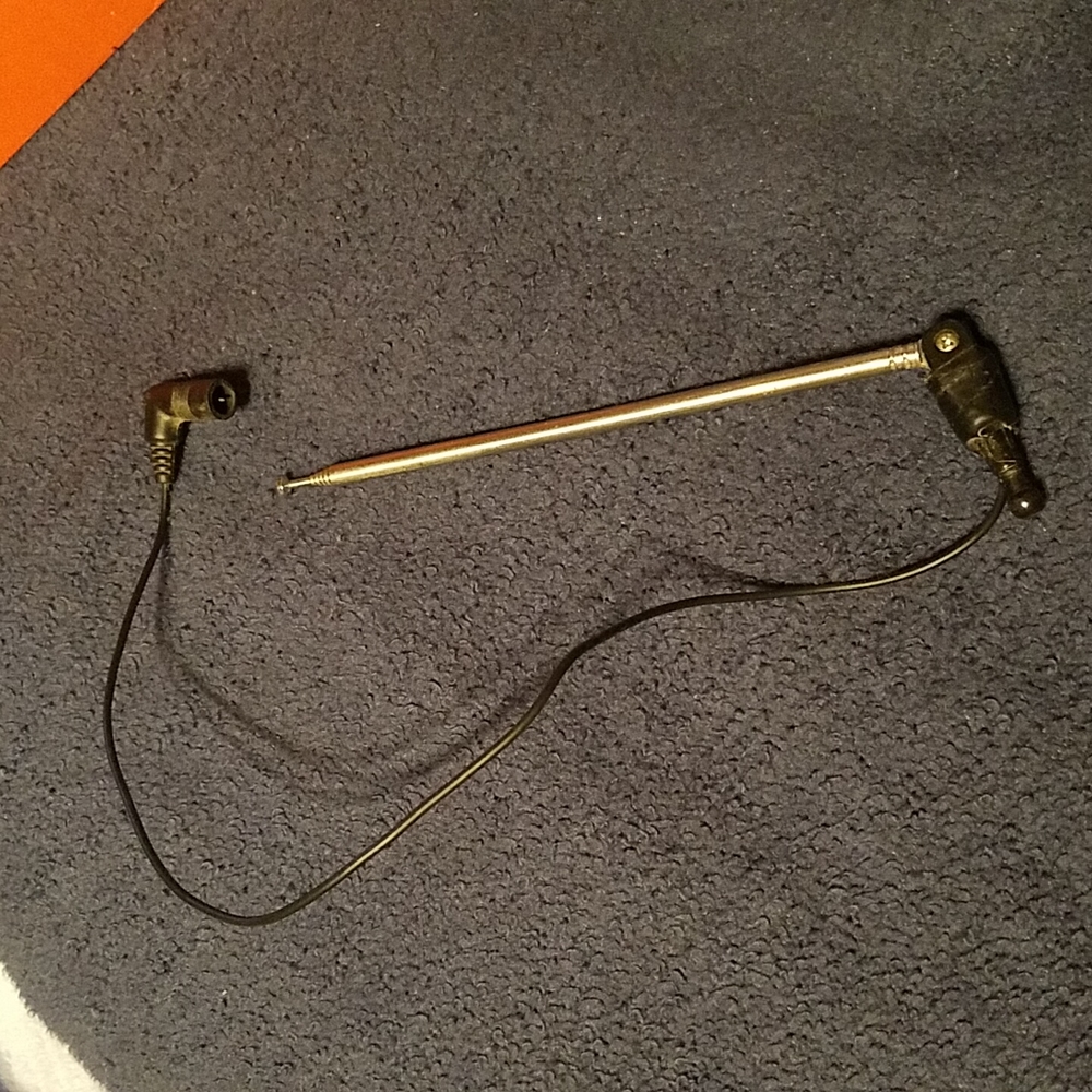 Vintage telescoping antenna. Has been repaired with electrical tape, as pictured